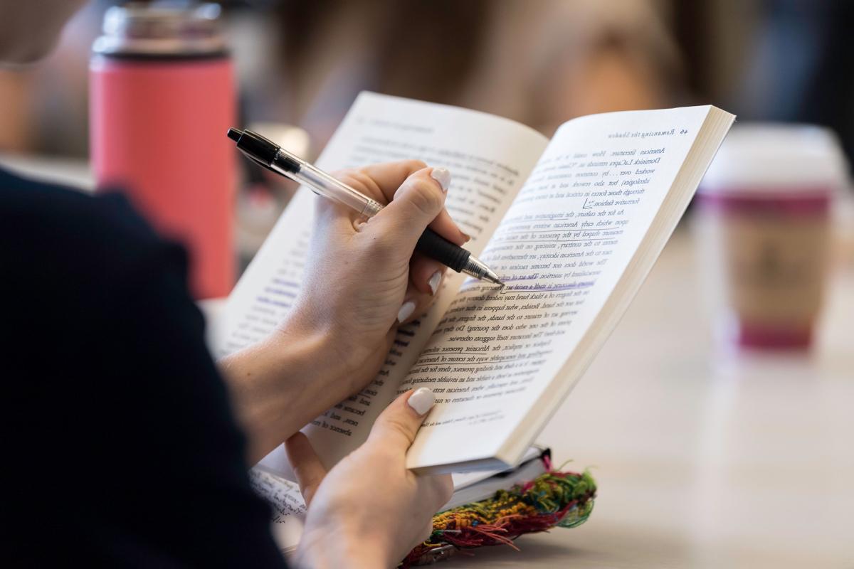 Student writes in classroom