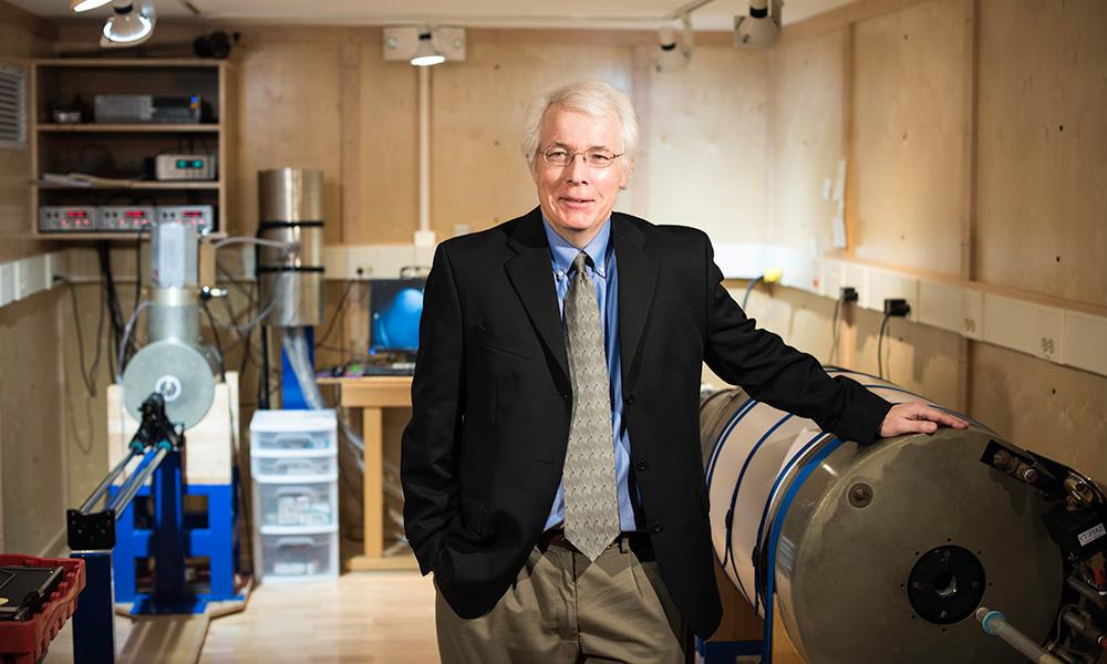 John Tarduno standing in a workshop.